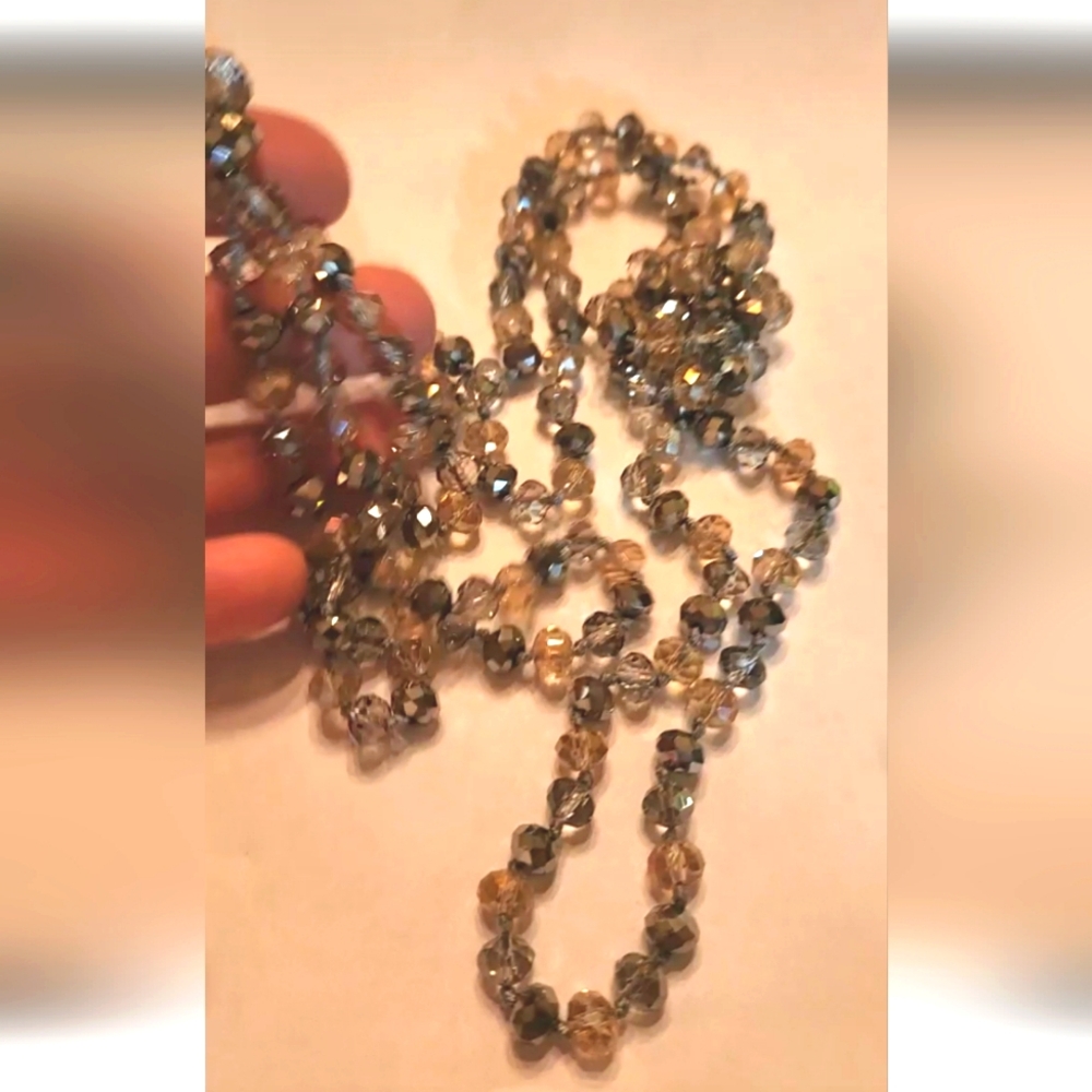 Long knotted crystal bead necklace smoky grey